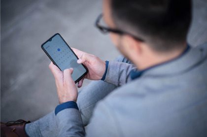 Man checking calendar on phone